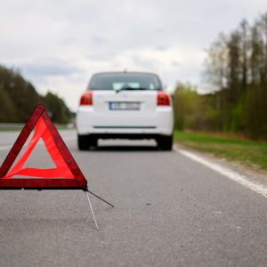 Broken car on a road side