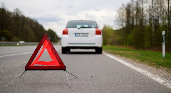 Broken car on a road side